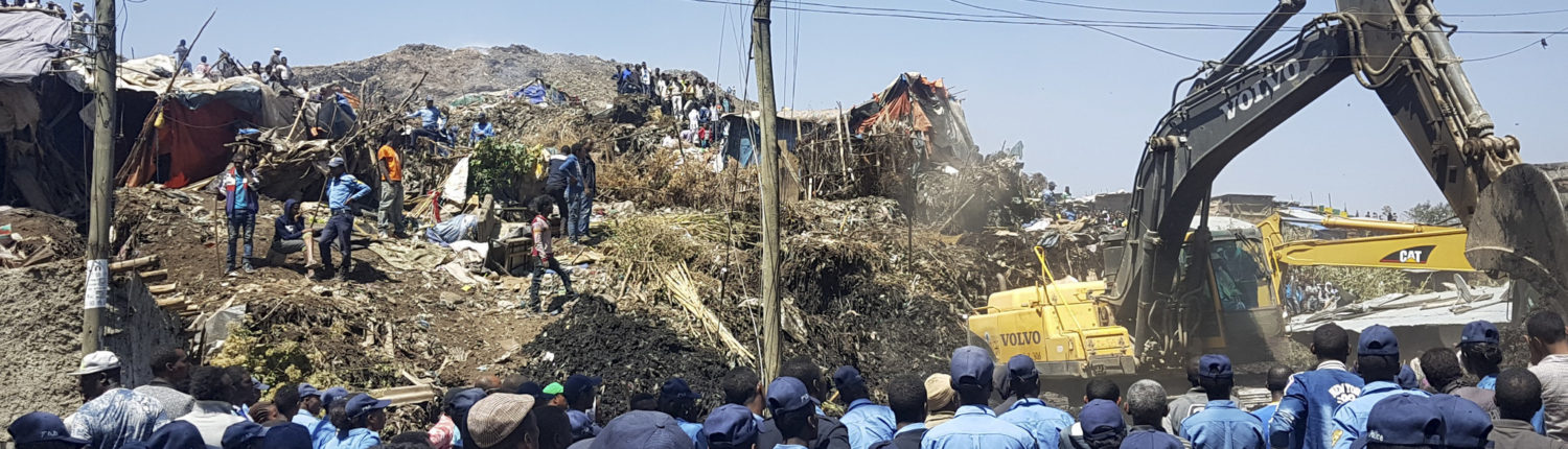Police officers secure the perimeter at the scene of a garbage landslide, as excavators aid rescue efforts, on the outskirts of the capital Addis Ababa, Ethiopia Sunday, March 12, 2017. Officials and residents say more than a dozen people have been killed in a landslide at a massive garbage dump on the outskirts of Ethiopia's capital, and several dozen people are missing. (Photo Elias Meseret | AP )